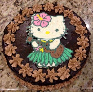 A Frosting Transfer of a Hello Kitty image decorates the top of this chocolate peanut butter cake